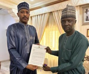 Sani Shaba’an submitting his letter of resignation at his ward.
