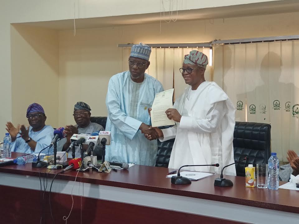 NUC Executive Secretary Prof Abubakar Rasheed handing over the provisional license of the new university to Osun State Governor, Adegboyega Oyetola, at the NUC headquarters in Abuja, on Thursday