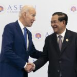 FILE – U.S. President Joe Biden shakes hands with Cambodian Prime Minister Hun Sen before their meeting during the Association of Southeast Asian Nations (ASEAN) summit, Saturday, Nov. 12, 2022, in Phnom Penh, Cambodia. Hun Sen said Tuesday, Nov. 15, 2022, he has tested positive for COVID-19 at the Group of 20 meetings in Bali, just days after hosting many world leaders, including President Joe Biden, for a summit in Phnom Penh. (AP Photo/Alex Brandon, File)