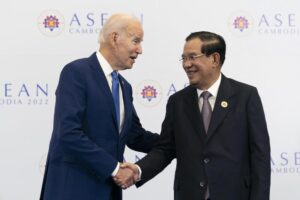 FILE – U.S. President Joe Biden shakes hands with Cambodian Prime Minister Hun Sen before their meeting during the Association of Southeast Asian Nations (ASEAN) summit, Saturday, Nov. 12, 2022, in Phnom Penh, Cambodia. Hun Sen said Tuesday, Nov. 15, 2022, he has tested positive for COVID-19 at the Group of 20 meetings in Bali, just days after hosting many world leaders, including President Joe Biden, for a summit in Phnom Penh. (AP Photo/Alex Brandon, File)