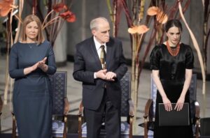 Oleksandra Matviychuk of Ukraine’s Center for Civil Liberties, right, receives applauds of audience after her speech during the Nobel Peace Prize ceremony at Oslo City Hall, Norway, Saturday, Dec. 10, 2022, The winners of this year’s Nobel Peace Prize from Ukraine, Russia and Belarus have shared their visions of a fairer world during an award ceremony and denounced Russian President Vladimir Putin’s war in Ukraine. (AP Photo/ Markus Schreiber)