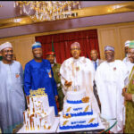 President Muhammadu Buhari flanked by SGF Mr. Boss Mustapha, Chief of Staff Prof Ibrahim Gambari, Permanent Secretary State House, Tijjani Umar, SSAP Malam Garba Shehu and SCOP Amb Lawan Kazaure  during his 80th Birthday at the Presidential Villa Abuja.