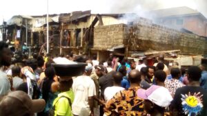 Men of the Edo State Fire Service battling to put off the inferno in Benin City
