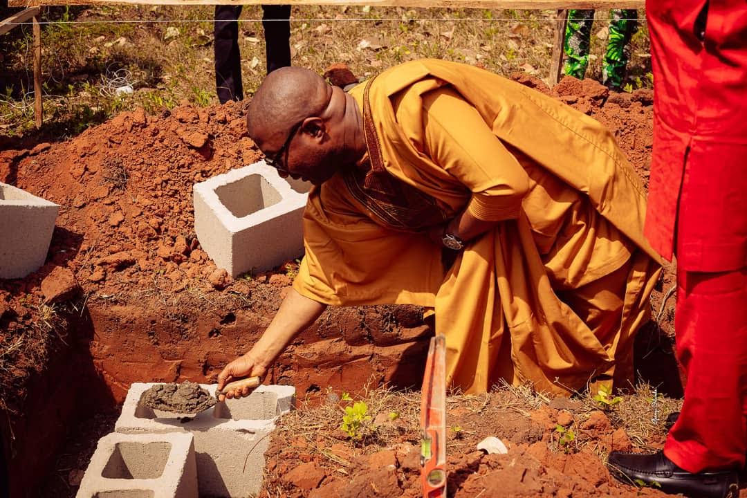 Charles Oguibe below performing the foundation laying ceremony