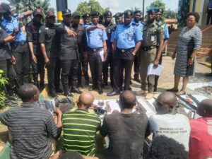 Some of the suspects and arms recovered parade at the Command Headquarters Diamond Hills Calabar on Thursday