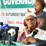 Commissioner of Police, Enugu State, Ahmad Ammani(left); Collation Officer, Enugu State, Prof. Maduebisisi Iwe, and Resident Electoral Commissioner (REC), Dr. Chukwuemeka Chukwu, during collation of 2023 governorship election results in Enugu (PHOTO: NAN)