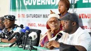 Commissioner of Police, Enugu State, Ahmad Ammani(left); Collation Officer, Enugu State, Prof. Maduebisisi Iwe, and Resident Electoral Commissioner (REC), Dr. Chukwuemeka Chukwu, during collation of 2023 governorship election results in Enugu (PHOTO: NAN)
