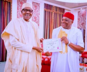 President Muhammadu Buhari (L), Senator Orji Uzor Kalu (R)