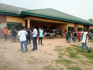 Candidates and parents waiting patiently at the JAMB examination centre in Elele on Tuesday