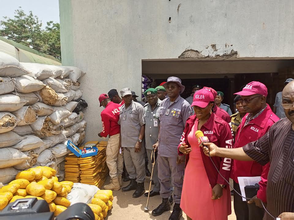 The Comptroller, Ogun 1 Area Command of the Nigeria Customs Service, Comptroller Bamidele Makinde and the Commander of Narcotics, Ogun State Command of the NDLEA, Mrs Ibiba Odili, at the handing over sacks and packs of Cannabis Sativa, seized by the operatives of the NCS