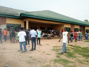 Candidates and parents waiting patiently at the JAMB examination centre in Elele on Tuesday