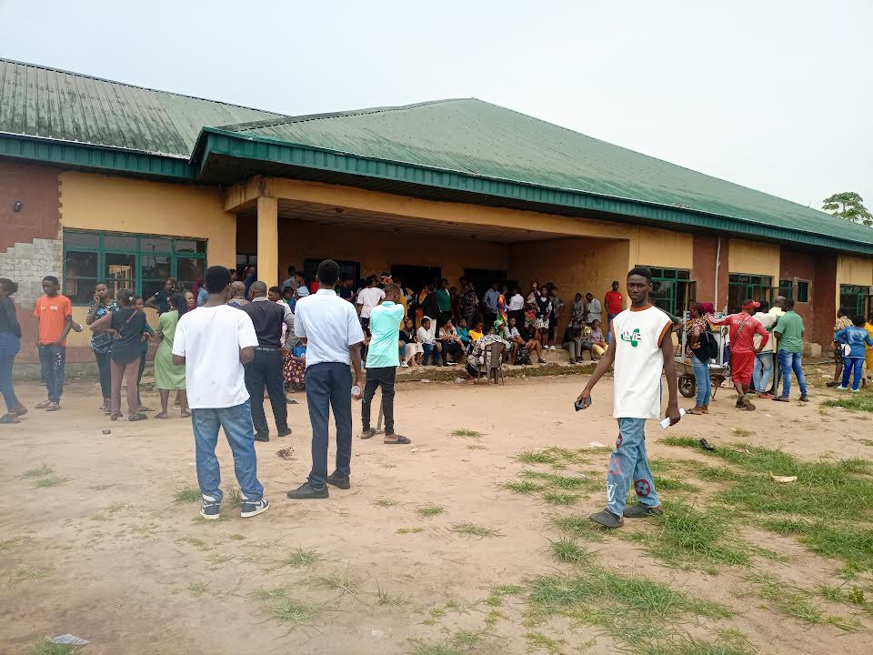 Candidates and parents waiting patiently at the JAMB examination centre in Elele on Tuesday