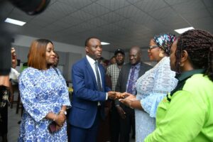 Seplat Energy officials presenting the key to the Lab to the Edo State Commissioner of Education, Joan Oviawe