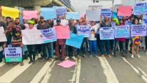 Protesters ground INEC headquarters, warn US, UK, others against promoting insurrection