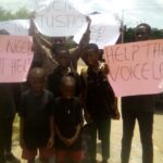 Children, wife and sister of the deceased during the protest in Benin City