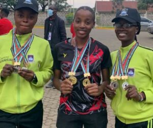 NUGA 2022 Badminton medallist Aminat Ilori (right) will represent Nigeria in China and her teammates, showing off their medals at UNIBEN