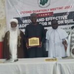 Co-chairmen of NIREC Sultan and CAN President presenting an award to SGF at the second quarterly meeting of the Council in Abuja for his support to the activities of NIREC over the years
