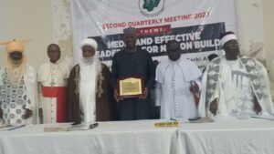 Co-chairmen of NIREC Sultan and CAN President presenting an award to SGF at the second quarterly meeting of the Council in Abuja for his support to the activities of NIREC over the years