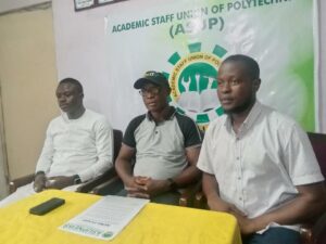 ASUP Chairman Ojo Monday (middle) flanked by two executives at the briefing