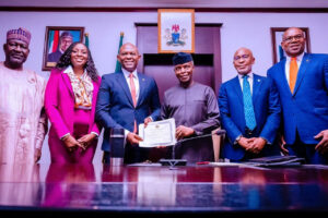 L-R Minister of Power, Abubakar Aliyu, President/GCEO of Transnational Corporation of Nigeria Plc, Owen Omogiafo, Chairman Transcrop Power Plc, Tony Elumelu, Vice President, Yemi Osinbajo, Director General of the Bureau of Public Enterprises, Alex Okoh and Ramon Nasir at the presentation of the Discharge Certificate to Transcorp Power Ltd on their acquisition of Ughelli Power Plant at the Statehouse