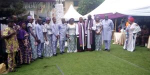 Bishops Ndubisi Obi (Nnewi Diocese) and Bishop Kingsley Obuh (Asaba Diocese) in a group photograph with members of the deceased family at the burial