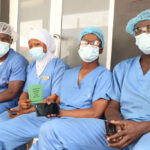 Health workers wait to take a dose of the Oxford/AstraZeneca coronavirus disease vaccine.