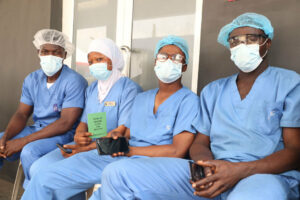 Health workers wait to take a dose of the Oxford/AstraZeneca coronavirus disease vaccine.