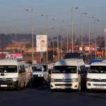 A traffic controller gestures in front of minibus taxis as they transport commuters to work, in Soweto, Johannesburg, South Africa June 15, 2017. (Reuters)