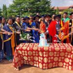 Management with some of the matriculating students cutting the cake