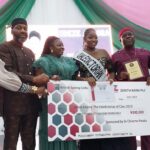 The Valedictorian receiving her cash reward
