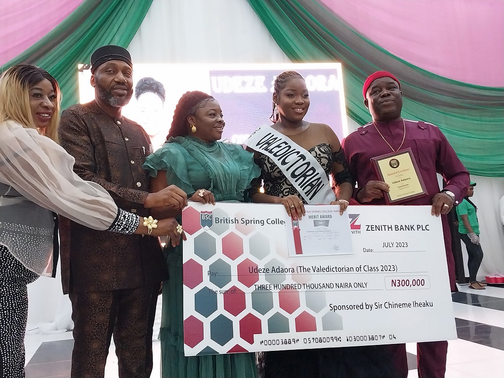 The Valedictorian receiving her cash reward
