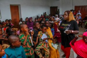 Cross section of pupils being empowered with educational materials at the event