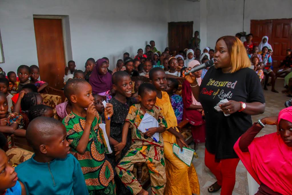 Cross section of pupils being empowered with educational materials at the event