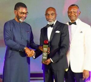 Former Director General, Nigerian Economic Summit Group (NESG), Frank Nweke and the Publisher, Businessday Newspaper, Frank Aigbogun presenting the award to the MD/CEO Wema Bank Plc, Moruf Oseni at the Awards ceremony held in Lagos