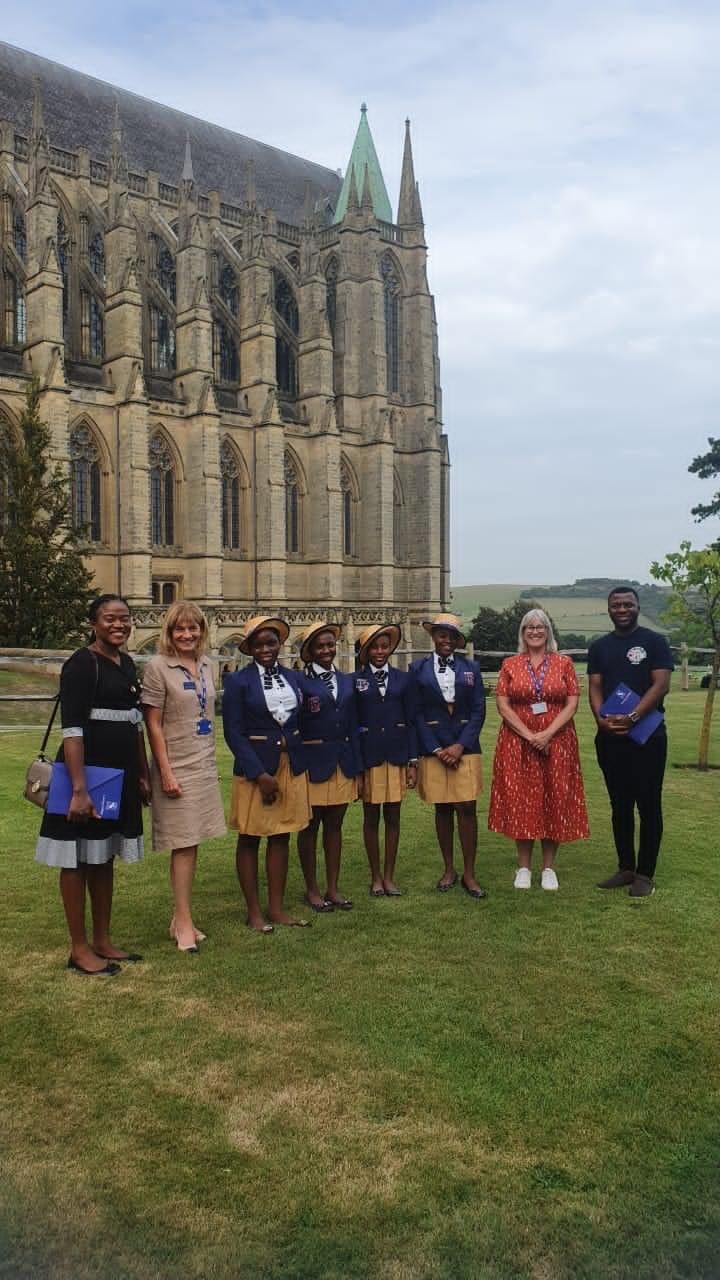 The visiting students and their priest manager with the hosts