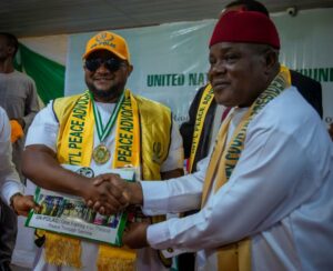 DR VICTOR EKPENYONG, (LEFT) CEO KENYON INTERNATIONAL, RECEIVING THE LAURELS FROM REPRESENTATIVE OF UN POLAC, AMB. PETET OHAGWA, DEPUTY COUNTRY PRESIDENT UN POLAC