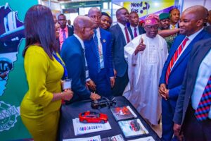 Pres. Tinubu thumbing up for Kia, while Olu Tikolo, VP, Kia Nigeria, and other guests watch…at the official opening ceremony of the 29th NES in Abuja, recentl