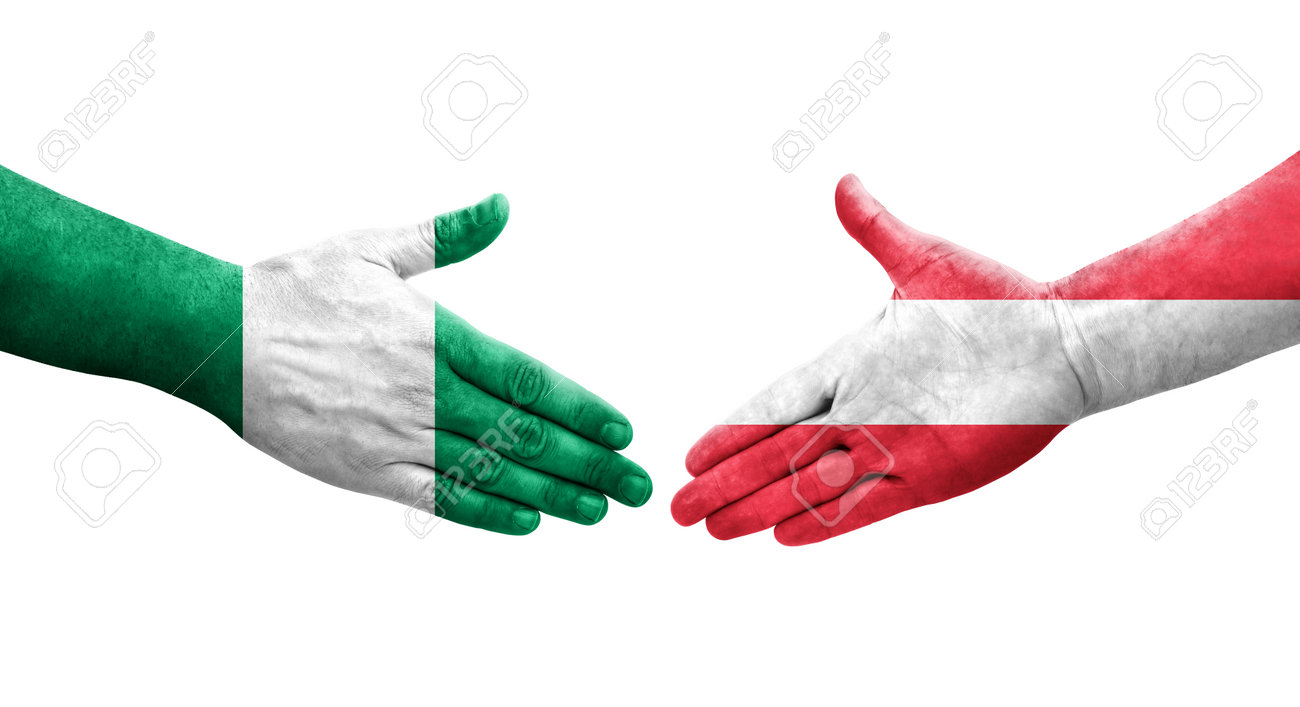 193188576-handshake-between-austria-and-nigeria-flags-painted-on-hands-isolated-transparent-image