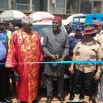 Hon. Sylvester Asogwa, the deputy chairman of Nsukka LGA cutting the the flag off tape