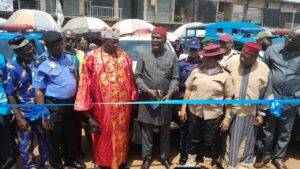 Hon. Sylvester Asogwa, the deputy chairman of Nsukka LGA cutting the the flag off tape