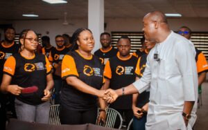 Valentine Ozigbo greets an Anambra Future Tech Scholar at Decagon on Nov 19, 2023 x