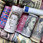 Euro, Hong Kong dollar, U.S. dollar, Japanese yen, pound and Chinese 100 yuan banknotes are seen in this picture illustration