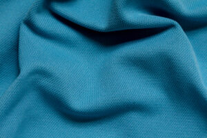 Wrinkled blue polyester sport fabric, full frame