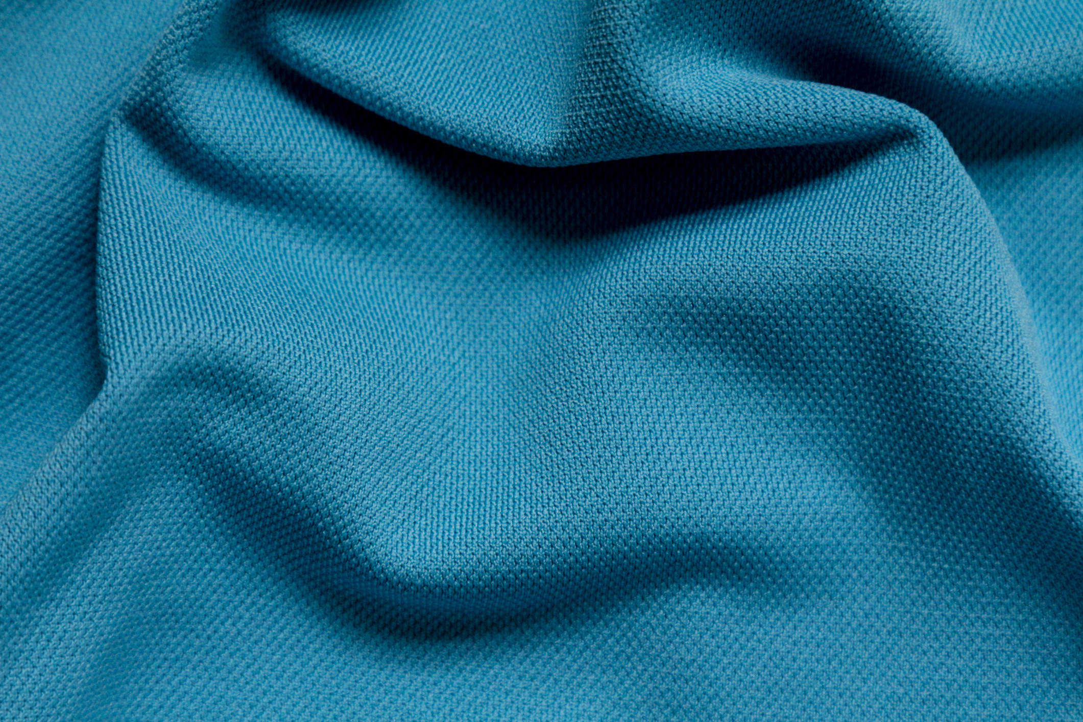 Wrinkled blue polyester sport fabric, full frame