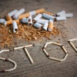 Stop smoking background with broken cigarettes