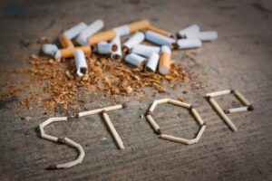 Stop smoking background with broken cigarettes