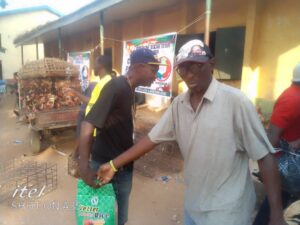 Handing rice to the benegiciaries