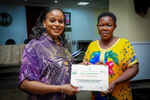 Mrs Soludo handing over the cheque to one of the beneficiaries (1)