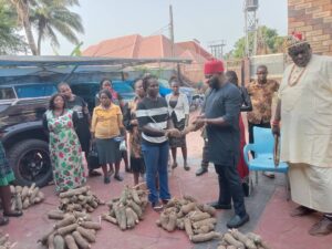 Onunkwo distributing the yam seedlings