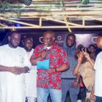 Chief of Staff to the Edo State governor Mr Osaigbovo Iyoha holding the document of land to be presented to the winner of the Clash of the Titans season 4 stage competition in Benin City